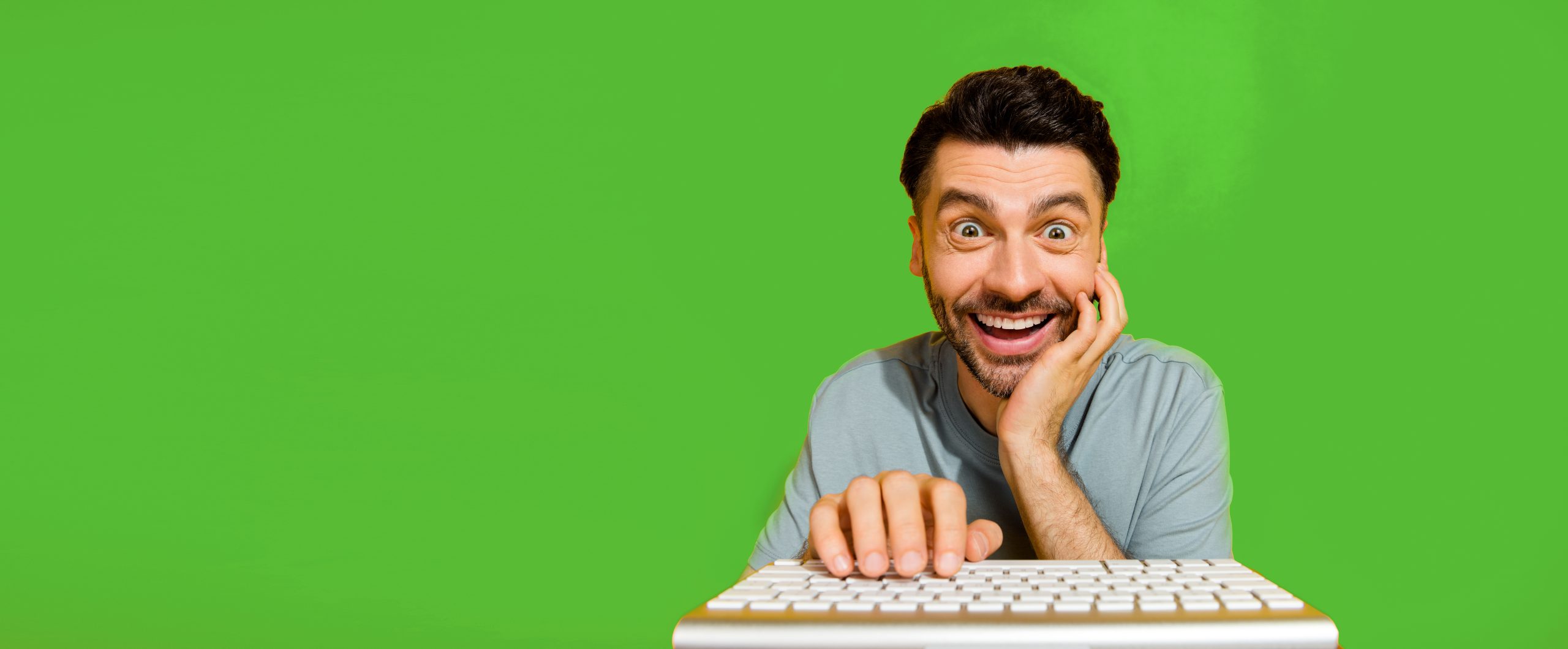 Closeup photo of excited man on a computer